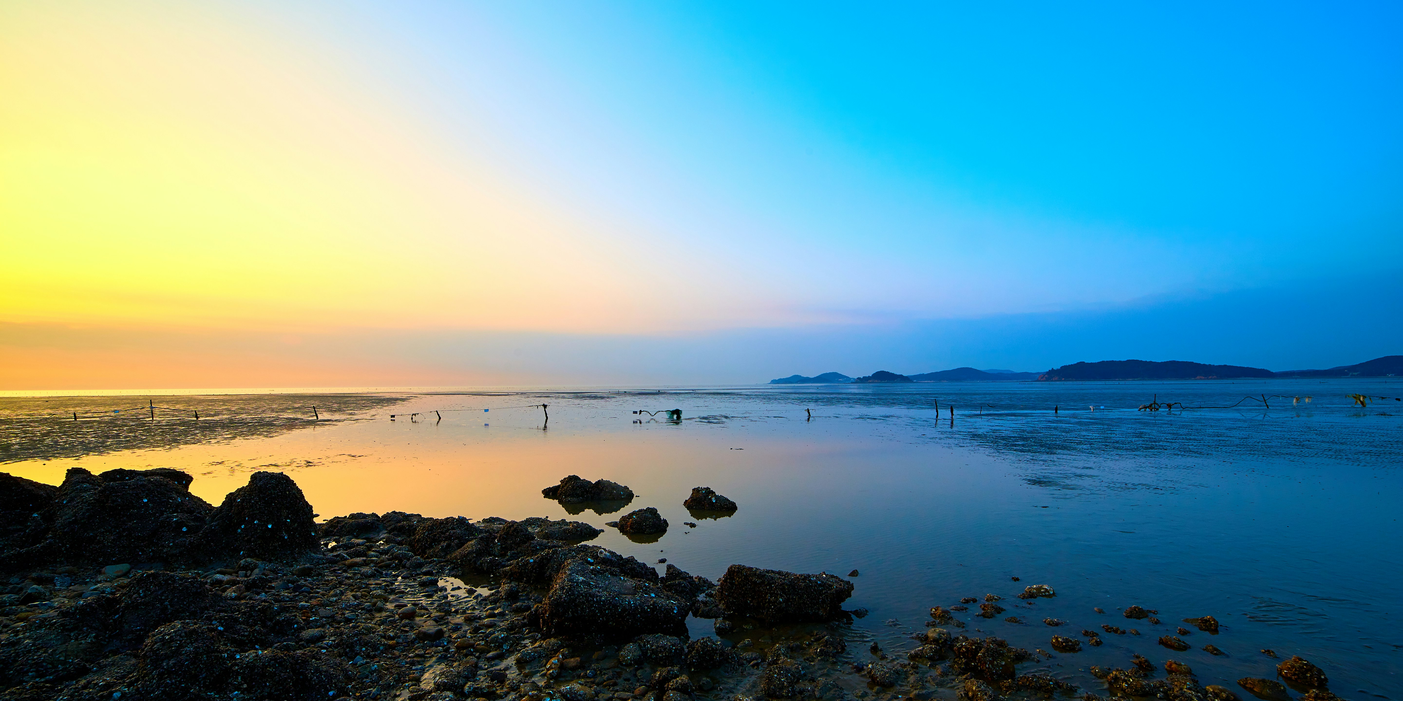 blue beach under clear blue sky